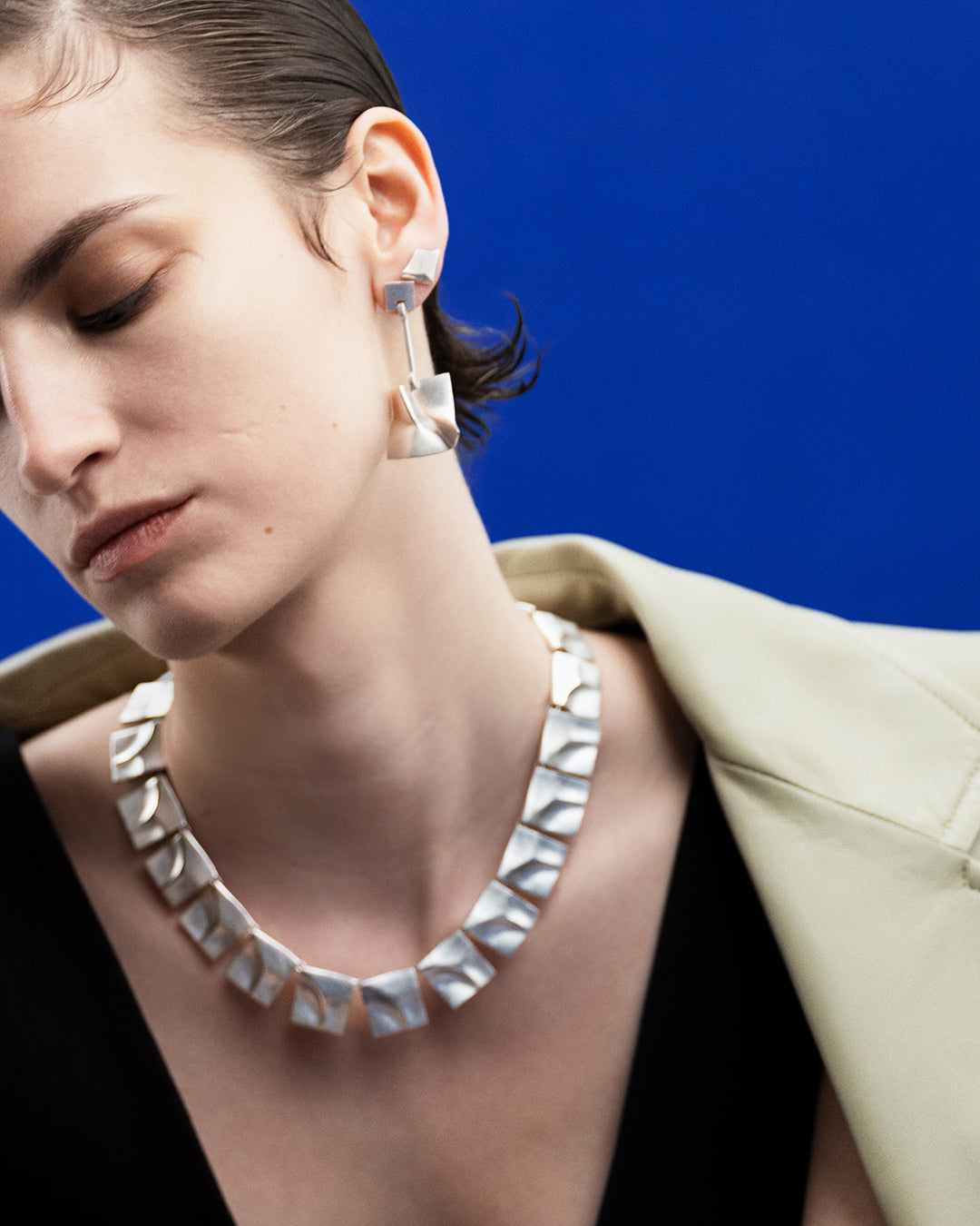 Galactic wind earrings silver half pair right