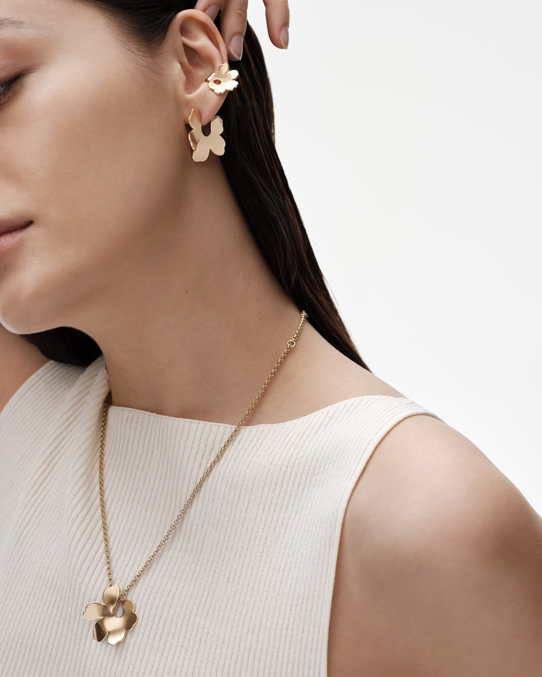 Unikko-korvakorut pienet pronssi puolipari vasen