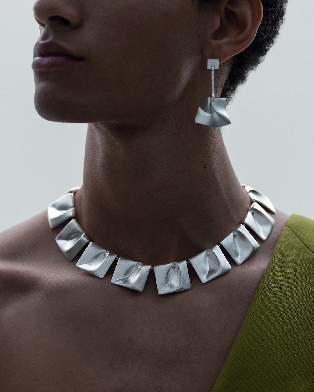 Galactic wind earrings silver half pair left