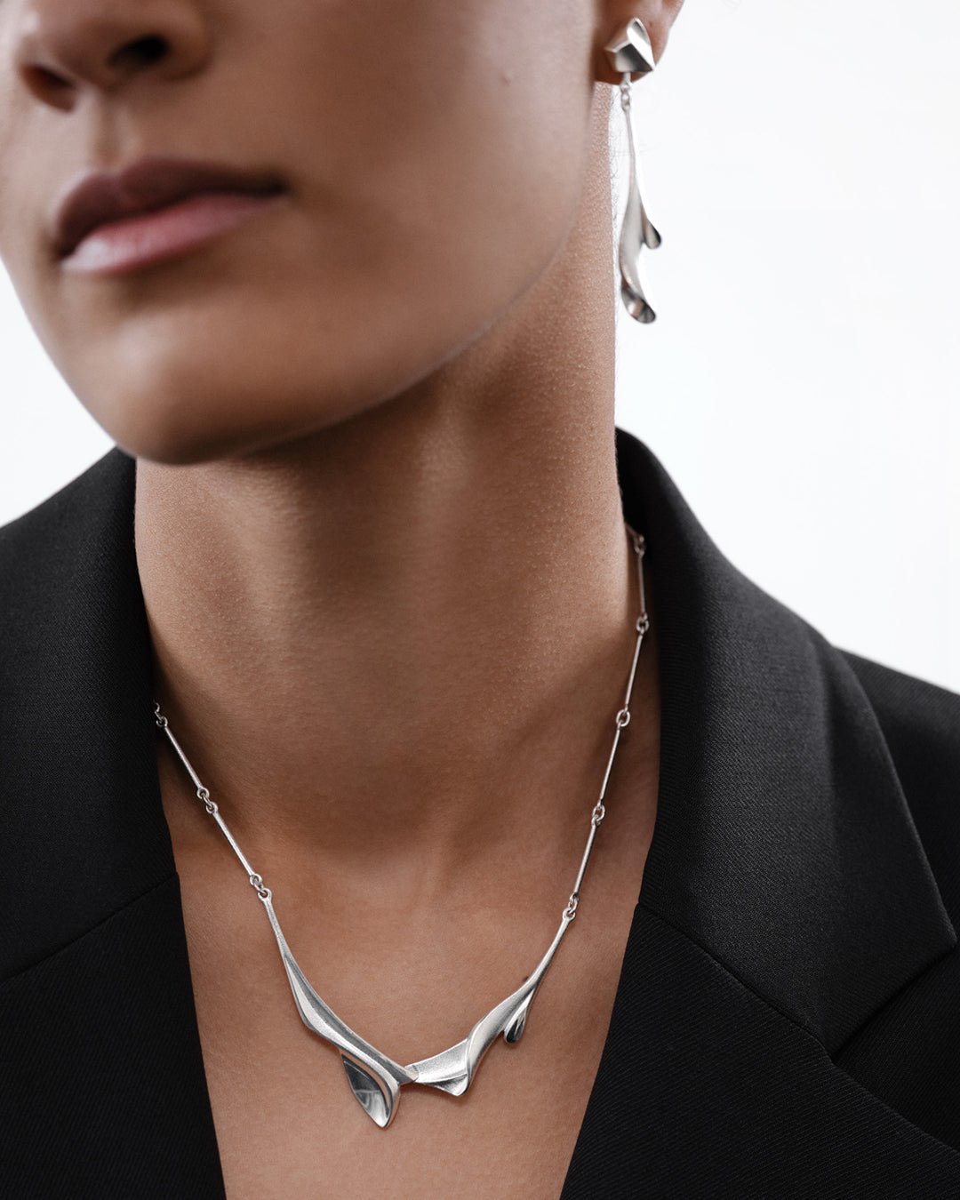 Arieta earrings silver half pair left