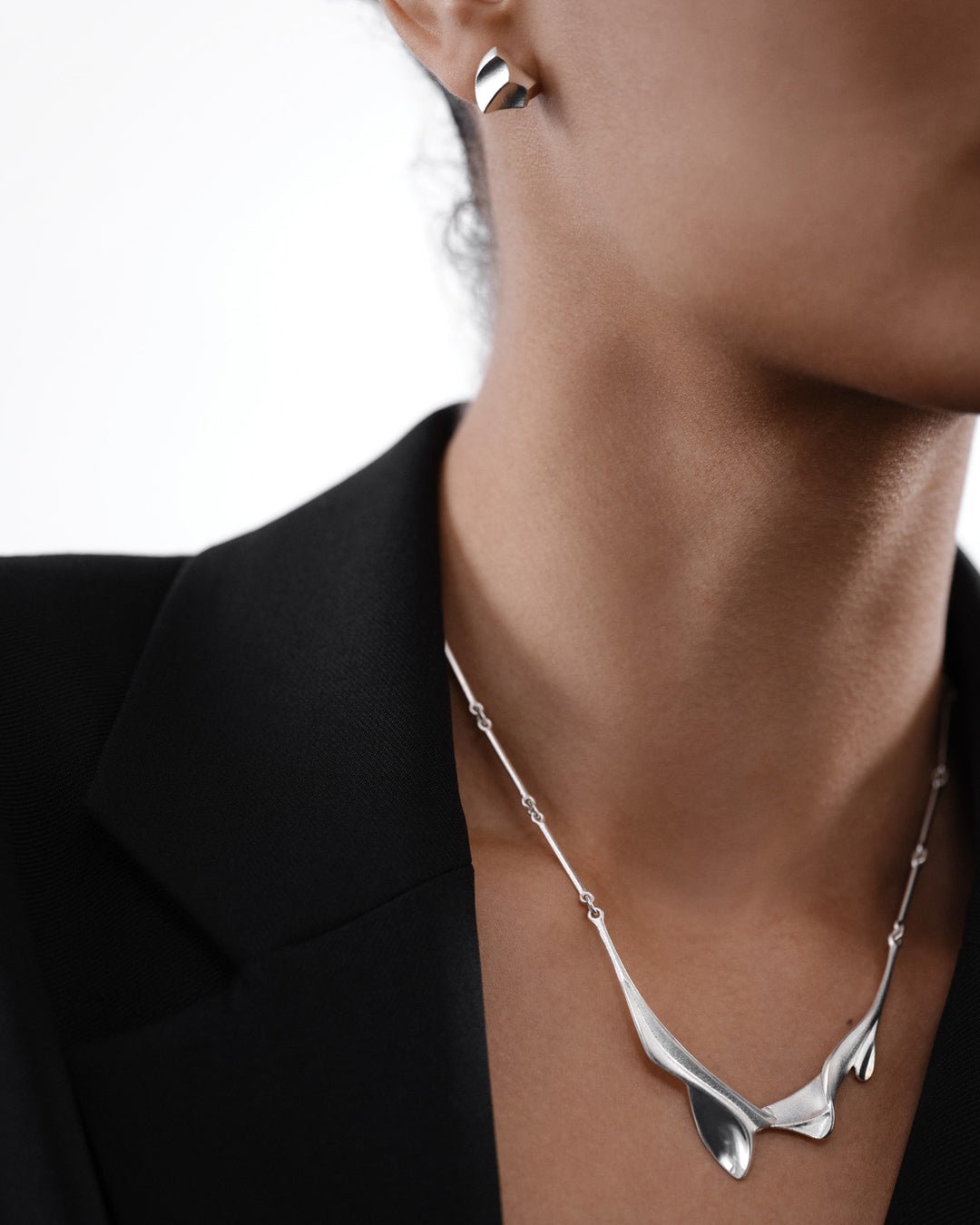 Arieta earrings silver half pair left