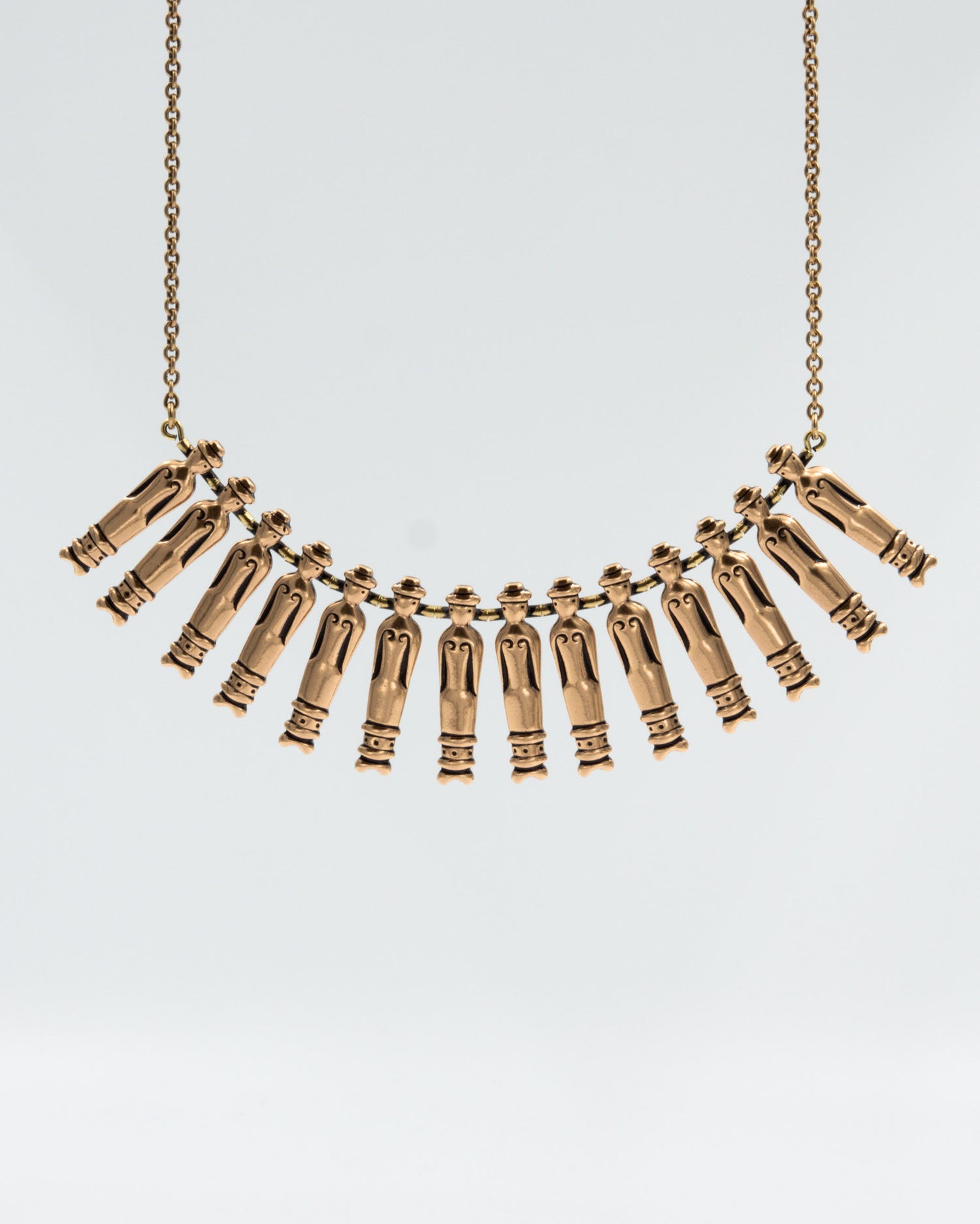 Held Doll-wrapped bronze