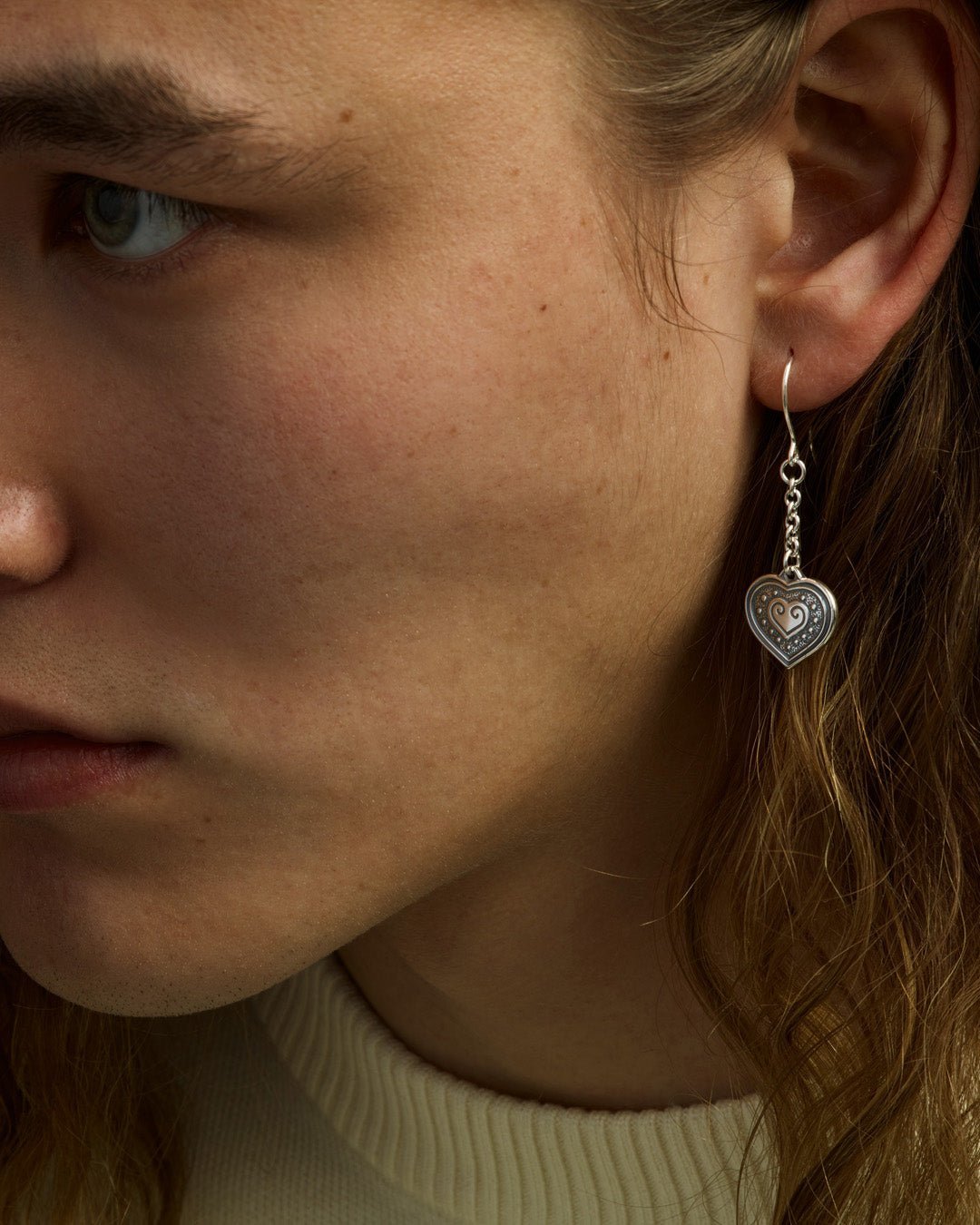 Eura's heart earrings silver half pair right