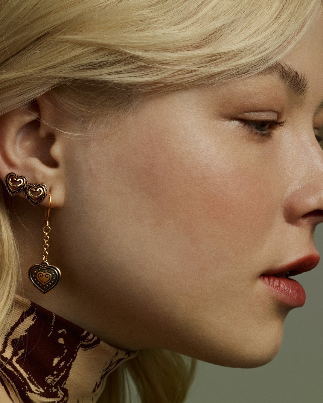 Eura heart earrings bronze half pair right